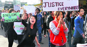 North-Eastern students in Dehradun on Monday protest against the murder of a 19-year-old student in Delhi .