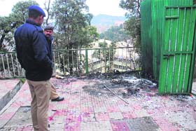Cops search through debris near the site of the blast in Shimla on Monday