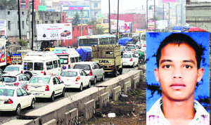 Stranded vehicles on the NH-1 after relatives of Kulwinder Singh (inset) blocked the road near Khanna on Monday. 