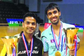 Pranaav Chopra (right) along with his partner Akshay Dewalkar after winning the men’s doubles event at All India Senior Ranking Tournament held at Kochi