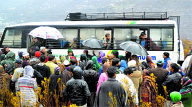 Passengers of the Karvane-e- Aman bus which was resumed between Srinagar and Muzaffarabad on Monday.