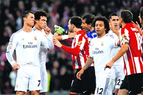 Real Madrids Cristiano Ronaldo (left) was dismissed for pushing an Athletic Bilbao player in the face on Sunday