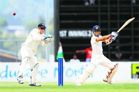 Ajinkya Rahane (60) plays a square cut on his way to a half-century against New Zealand XI on Monday