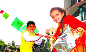 Children fly 150 kites attached to a string as a part of Basant Panchami celebrations at The Gurukul, Sector 21, Panchkula, on Tuesday.