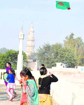 Girls fly kites on Basant Panchmi in Karnal on Tuesday