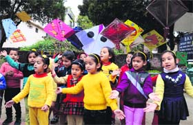 Students of DAV Centenary Public School dress up in bright colours to celebrate Basant Panchmi in Mandi on Tuesday