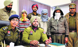 The accused in police custody in Ludhiana on Tuesday. Photo: Inderjeet Verma