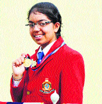 Cadet Japleen Kaur shows her silver medal won during the All-India Best Cadet Competition held in New Delhi. Tribune photo