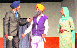 Artistes perform a play during Karmo, a sound and light show, organised by I&B Ministry in Ludhiana. a tribune photograph