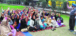 Mid-day meal workers stage a protest against the state government in Ludhiana on Tuesday. Tribune Photo: Inderjeet Verma