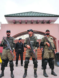 Security personnel outside Pervez Musharrafs farmhouse