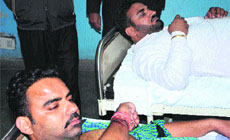 President Arhtiya union, Narinder Behal and his brother, Varinder Kumar, who were admitted in hospital after a clash in the Grain Market in Amritsar on Wednesday.