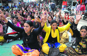 Members of the AIE/EGS Teachers' Union resume their dharna in Bathinda on Wednesday