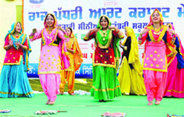 festive mood: Students perform giddha during the state-level art and craft festival held at Government Girls Senior Secondary School in Maluka village on Wednesday.