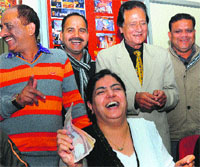 BJP candidate Harmohan Dhawan (standing second from right) and Ranjna Shahi in jubilant mood at the Sector 33 BJP office in Chandigarh on Wednesday. Tribune Photo: S Chandan