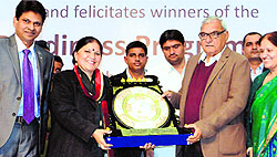 Education minister Geeta Bhukkal presents a memento to Chief Minister Bhupinder Singh Hooda at the launch of the Mukhyamantri Shiksha-Deeksha Yojana in Gurgaon on Wednesday
