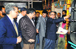 Agriculture Minister Ghulam Hassan Mir inaugurates Horizontal Autoclave in Jammu on Wednesday. A Tribune Photograph