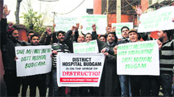 The Jammu and Kashmir Youth Development Front, Budgam, stages a protest against senior officials of the District Hospital, Budgam, on Wednesday. Tribune photo: Amin War 