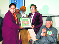 General President of the Indian Science Congress RC Sobti felicitates Governor's wife Usha Vohra during the Women Science Congress at Jammu University on Wednesday. A Tribune photograph 