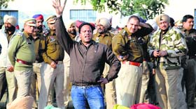 A teacher raises slogans against the state government during a protest in Ludhiana on Wednesday