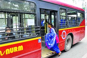 A woman boards one of the newly introduced buses in Ludhiana on Wednesday