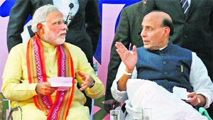 BJP's prime ministerial candidate Narendra Modi and party president Rajnath Singh at a rally in Kolkata on Wednesday