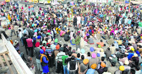 Protesters, with support from the NGOs and political parties, block traffic in Bathinda outside the bus stand in Bathinda on Thursday.