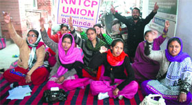 Members of the RNTCP union hold a dharna against the Punjab government at the Civil Hospital in Bathinda on Thursday.