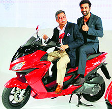Bollywood actor Ranbir Kapoor with Hero MotoCorp CEO Pawan Munjal at the launch of new range of bikes at the Auto Expo 2014 in Greater Noida on Thursday