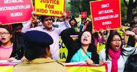 Northeastern students shout slogans during their protest against the killing of Nido Tania, at Parliament Street in New Delhi on Thursday.