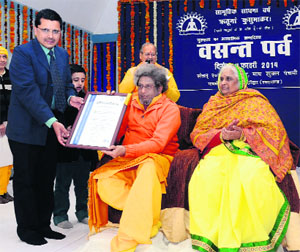 Dev Sanskriti University Chancellor Pranav Pandya being given ISO certification in Haridwar on Thursday