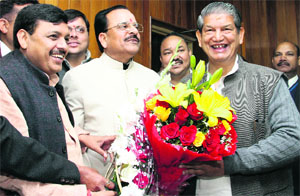 Chief Minister Harish Rawat being greeted by Leader of Opposition Ajay Bhatt on the first day of the Budget session of the state Assembly in Dehradun on Thursday.