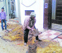 A road broken in Shaheed Babu Labh Singh Nagar for laying a sewer pipe to an alleged illegal colony in Jalandhar. A Tribune photograph