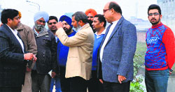 MC officials at the site of the link road in Ludhiana on Thursday. Photo: Inderjeet Verma
