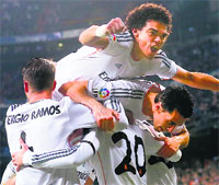 Pepe celebrates Real Madrids second goal with teammates during their Spanish Kings Cup semifinal first leg against Atletico Madrid on Wednesday. Reuters