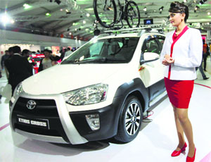 A model poses with Etios Cross at Toyota pavilion