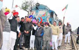 Activists of the BJP Kisan Morcha during their rail roko protest near Shergarh village in Bathinda on Friday.