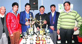 Arun Sharma (3rd from right) along with organisers unveil the CII trophies for the CII-ATS Corporate Sports League at Sector 31 in Chandigarh on Friday.