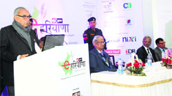 Chief Minister Bhupinder Singh Hooda speaks at the e-Haryana event at the UT Guest House in Chandigarh on Friday. Tribune photo: S Chandan