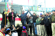 Kisan Morcha leaders address activists from the engine of the Shatabadi Express at Phagwara station on Friday
