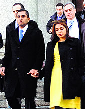 Indian-origin Mathew Martoma along with his wife Rosemary leaves a court in New York on Thursday after being convicted of helping his firm earn billions illegally through trades based on secrets about the testing of a breakthrough Alzheimer's drug