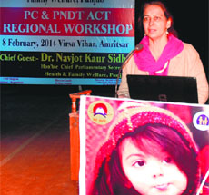 Chief Parliamentary Secretary Dr Navjot Kaur Sidhu addresses a gathering during the PC-PNDT Act regional workshop at Virsa Vihar in Amritsar on Saturday. 
