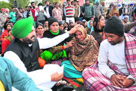 Congress ex-MLA Harminder Singh Jassi consoles Kiranjit Kaur and Taranjit Singh, parents of Rooth, in Bathinda on Saturday