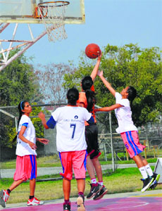 A match in progress during the IMG Reliance Punjab Colleges Basketball League that began at the PAU, Ludhiana, on Saturday. 