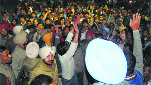 Residents hold a protest after the firing incident in Ludhiana on Thursday.