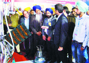Punjab Dairy Development, Animal Husbandry and Fisheries Minister Gulzar Singh Ranike inspects a stall at the exposition in Jagraon on Saturday.