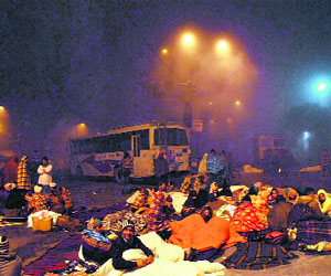 Winter of discontent: Protesting teachers spend the night in the open amid the winter chill outside the bus stand in Bathinda.