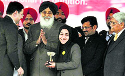 Rumaisa of Aryans College of Engineering, Chandigarh, being felicitated by Punjab Chief Minister Parkash Singh Badal for developing an Android application