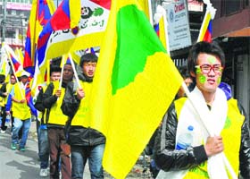 Members of the Tibetan Youth kick off the march at McLeodganj on Saturday