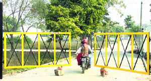An illegally erected gate on a road in Mithapur village in Jalandhar.